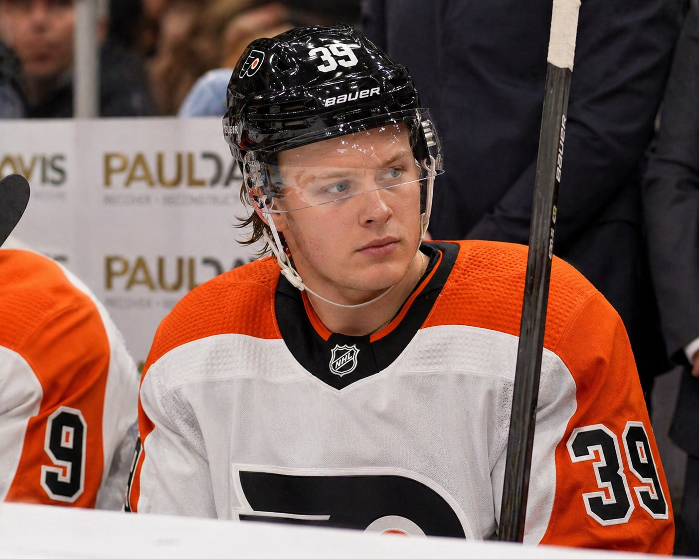 AI-generated image of Flyers forward Matvei Philadelphia Michkov sitting on the bench during a game